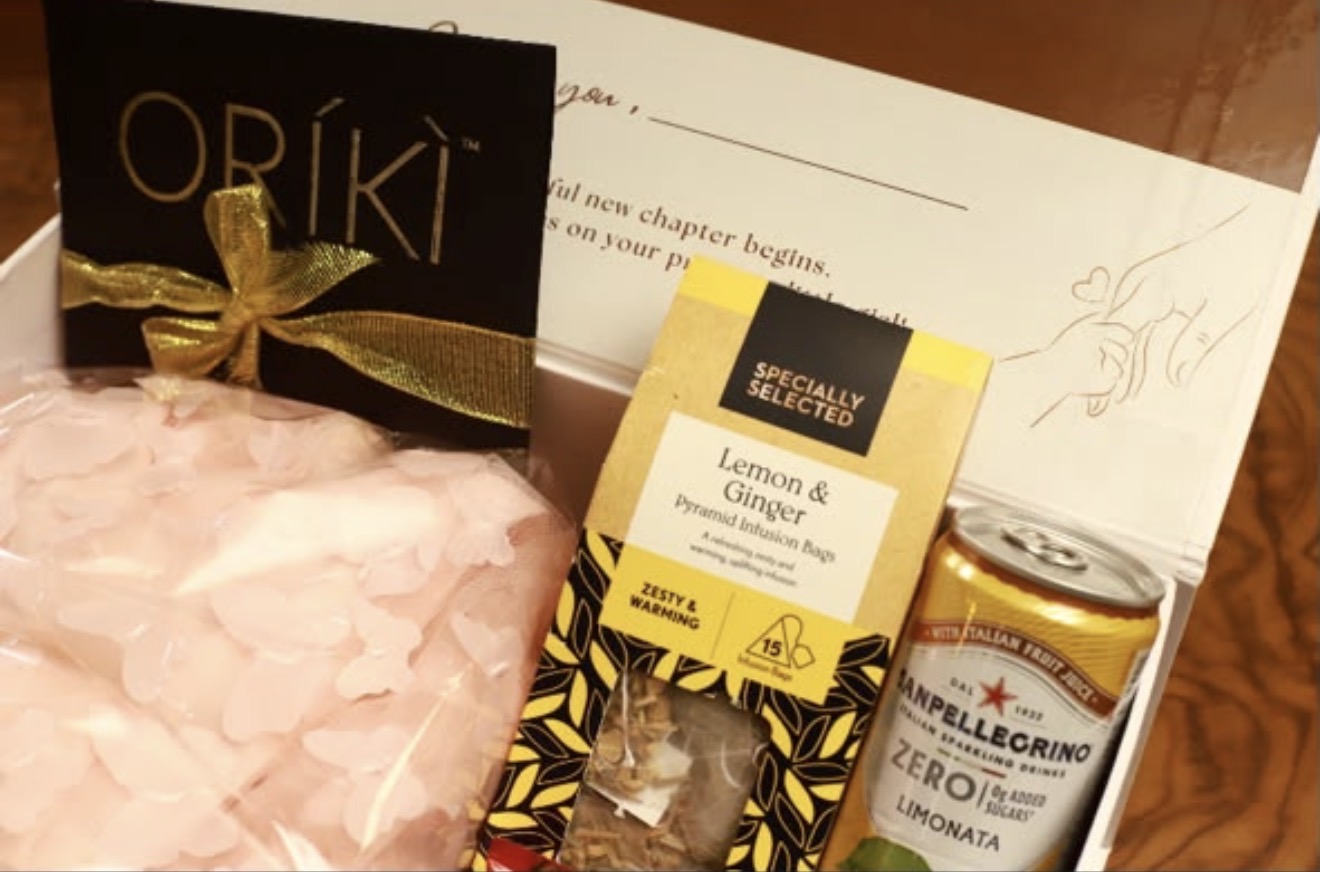 Inside the new mum gift box — treats, tea, sparkling limonata and a handwritten note